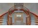 Elegant foyer features a grand staircase and tile flooring, creating a welcoming entrance at 10829 Ickworth Ct, Las Vegas, NV 89135