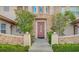 Inviting entryway showcasing a beautiful front door, stone accents, and manicured greenery at 10829 Ickworth Ct, Las Vegas, NV 89135