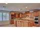 Spacious kitchen with granite countertops, stainless steel appliances and custom wood cabinetry at 10829 Ickworth Ct, Las Vegas, NV 89135