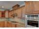 Gourmet kitchen boasting stainless steel appliances, granite countertops, and custom cabinetry at 10829 Ickworth Ct, Las Vegas, NV 89135