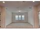 Open-concept living room bathed in natural light from the bay window is perfect for entertaining at 10829 Ickworth Ct, Las Vegas, NV 89135