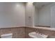 Classic powder room featuring pedestal sink, tile flooring and large mirror at 10829 Ickworth Ct, Las Vegas, NV 89135