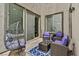 Relaxing backyard patio with brick pavers, outdoor furniture, and patio lights at 11023 Ketchikan St, Las Vegas, NV 89179