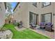 Cozy backyard features artificial turf, patio furniture, and a built-in gas grill at 11023 Ketchikan St, Las Vegas, NV 89179