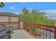Charming balcony with wrought iron railings and cozy seating area, offering a relaxing outdoor space at 11023 Ketchikan St, Las Vegas, NV 89179