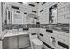 Modern bathroom features sleek white subway tiles accented with black accents, a floating vanity, and a stylish mirror at 11023 Ketchikan St, Las Vegas, NV 89179