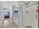 Modern bathroom with glass shower and bathtub offering a serene space with tile floors and gray wall at 11023 Ketchikan St, Las Vegas, NV 89179