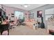 Bright bedroom featuring ample natural light, pink accents, and neutral carpet at 11023 Ketchikan St, Las Vegas, NV 89179