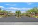Inviting community entrance featuring well-maintained landscaping and decorative pergola features for a welcoming first impression at 11023 Ketchikan St, Las Vegas, NV 89179