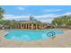 Community pool featuring a diving area and lounge seating surrounded by mature trees at 11023 Ketchikan St, Las Vegas, NV 89179