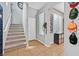 Inviting entryway with tile flooring, staircase, and decoratively adorned walls at 11023 Ketchikan St, Las Vegas, NV 89179