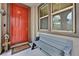 Welcoming front porch with a vibrant red door, bench seating, and a 'Welcome' mat at 11023 Ketchikan St, Las Vegas, NV 89179