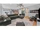 Comfortable living area with sectional sofa, media display, and seamless flow to the kitchen at 11023 Ketchikan St, Las Vegas, NV 89179