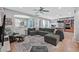Spacious living room featuring a large sectional, neutral decor, and open layout at 11023 Ketchikan St, Las Vegas, NV 89179