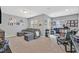 Spacious living room with comfortable sectional sofa, large windows, and carpeted floors, perfect for relaxing at 11023 Ketchikan St, Las Vegas, NV 89179