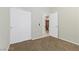 Clean bedroom featuring neutral carpet and a closet, with an open doorway at 11076 Zampino St, Las Vegas, NV 89141