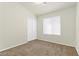 Cozy bedroom with neutral tones, featuring a closet and a bright window at 11076 Zampino St, Las Vegas, NV 89141