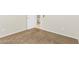 Empty bedroom featuring neutral carpet, an open doorway and light walls at 11076 Zampino St, Las Vegas, NV 89141