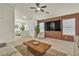 Modern living room featuring stylish furniture, a decorative wall, and ample natural light, creating a comfortable space at 11076 Zampino St, Las Vegas, NV 89141