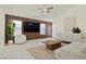 A bright and modern living room features contemporary decor, neutral tones, and a cozy ambiance at 11076 Zampino St, Las Vegas, NV 89141