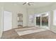 Spacious main bedroom featuring plush carpet, sliding glass doors, and an ensuite bathroom at 11076 Zampino St, Las Vegas, NV 89141