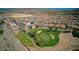 Aerial view of the neighborhood and golf course nearby with the home at 1172 Strada Pecei at 1172 Strada Pecei, Henderson, NV 89011