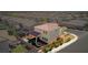 Aerial view of the backyard featuring a covered patio and a hot tub in a landscaped yard at 1172 Strada Pecei, Henderson, NV 89011