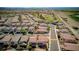 A high aerial view of the home at 1172 Strada Pecei in a neighborhood with golf course nearby at 1172 Strada Pecei, Henderson, NV 89011