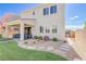Beautiful home backyard featuring an ample patio, gravel and rock landscaping, and an outdoor seating area at 1172 Strada Pecei, Henderson, NV 89011