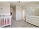 Comfortable Bedroom with crib, changing table, and cute nautical-themed wall art at 1172 Strada Pecei, Henderson, NV 89011