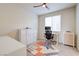 Bright bedroom featuring plush carpet, ceiling fan, window with shutters, and desk at 1172 Strada Pecei, Henderson, NV 89011