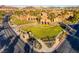 This image features a grand clubhouse entrance with manicured lawns and a welcoming atmosphere for residents at 1172 Strada Pecei, Henderson, NV 89011