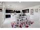Modern kitchen and dining area featuring stainless appliances, and white countertops at 1172 Strada Pecei, Henderson, NV 89011