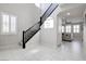Bright entryway features staircase, window with shutters, and access to the living room at 1172 Strada Pecei, Henderson, NV 89011
