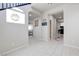 Bright foyer with white tile flooring, white walls, and open floorplan at 1172 Strada Pecei, Henderson, NV 89011