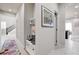 Hallway offers a storage bench, wall decor, and access to other rooms in the house at 1172 Strada Pecei, Henderson, NV 89011