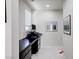 Hallway featuring a desk with drawers and artwork hanging on the wall at 1172 Strada Pecei, Henderson, NV 89011
