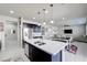 Open-concept kitchen offers a large island with sink and breakfast bar, connecting to the living area at 1172 Strada Pecei, Henderson, NV 89011