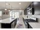 Charming kitchen features a spacious island, stainless steel appliances, and gas range at 1172 Strada Pecei, Henderson, NV 89011