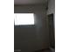 A sunlit bedroom with a window and closet at 1316 Lawry Ave, Las Vegas, NV 89106