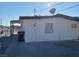 Exterior view of a home with a side yard and black waste container at 1316 Lawry Ave, Las Vegas, NV 89106