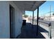 A view of the exterior side of the home with a covered porch at 1316 Lawry Ave, Las Vegas, NV 89106