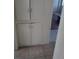 Hallway with white cabinetry and neutral floor tiles at 1316 Lawry Ave, Las Vegas, NV 89106