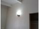 A detailed view showcases the textured wall with a mounted light fixture and door frame at 1316 Lawry Ave, Las Vegas, NV 89106