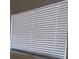 The window has white blinds at 1316 Lawry Ave, Las Vegas, NV 89106