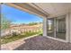 Relaxing back patio with brick pavers and a view of the desert landscape at 187 Palm Fox Ct, Henderson, NV 89011