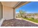 Covered back patio offering stunning views of the surrounding mountains and neighborhood at 187 Palm Fox Ct, Henderson, NV 89011