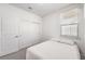 Modest bedroom featuring a window with blinds and a sliding-door closet at 187 Palm Fox Ct, Henderson, NV 89011