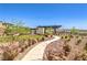 Scenic community pathway with desert landscaping and inviting gathering spaces at 187 Palm Fox Ct, Henderson, NV 89011