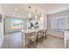 Modern kitchen with white cabinetry, stainless steel appliances, and a breakfast bar with seating at 187 Palm Fox Ct, Henderson, NV 89011
